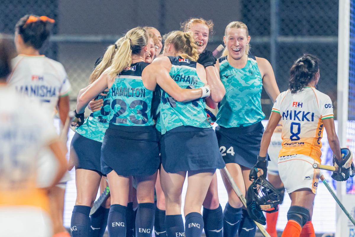 England hockey players celebrate their win over India in Bhubaneswar on Sunday