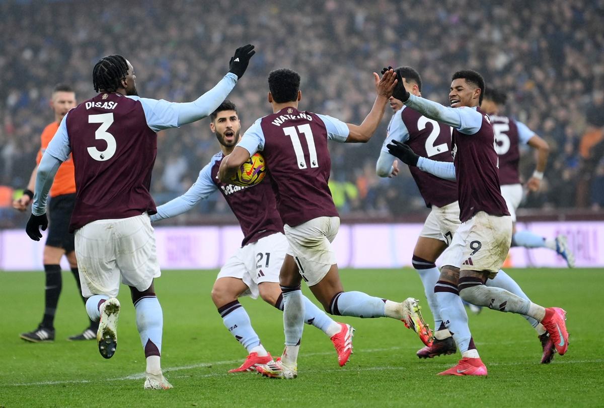 Ollie Watkins celebrates with teammates after finding the equaliser for Aston Villa.