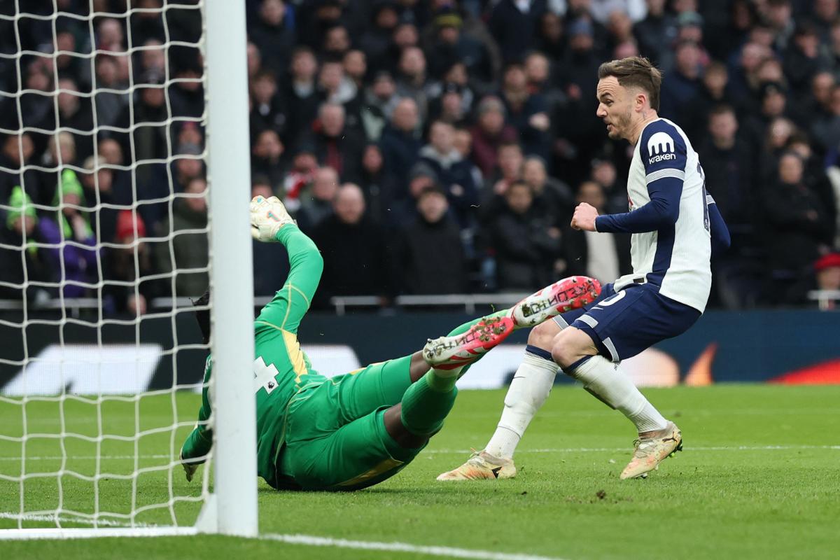 Tottenham Hotspur's James Maddison scores their first goal past Manchester United's Andre Onana during their EPL match at Tottenham Hotspur Stadium, London, on Sunday