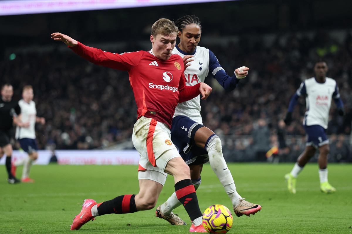 Manchester United's Rasmus Hojlund in action with Tottenham Hotspur's Djed Spence