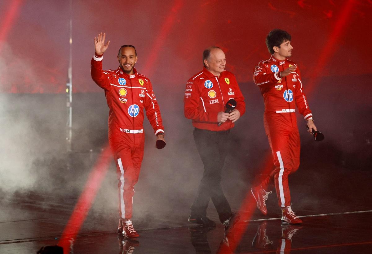 Seven-times World champion Lewis Hamilton with team principal Frederic Vasseur and Charles Leclerc during the launch.