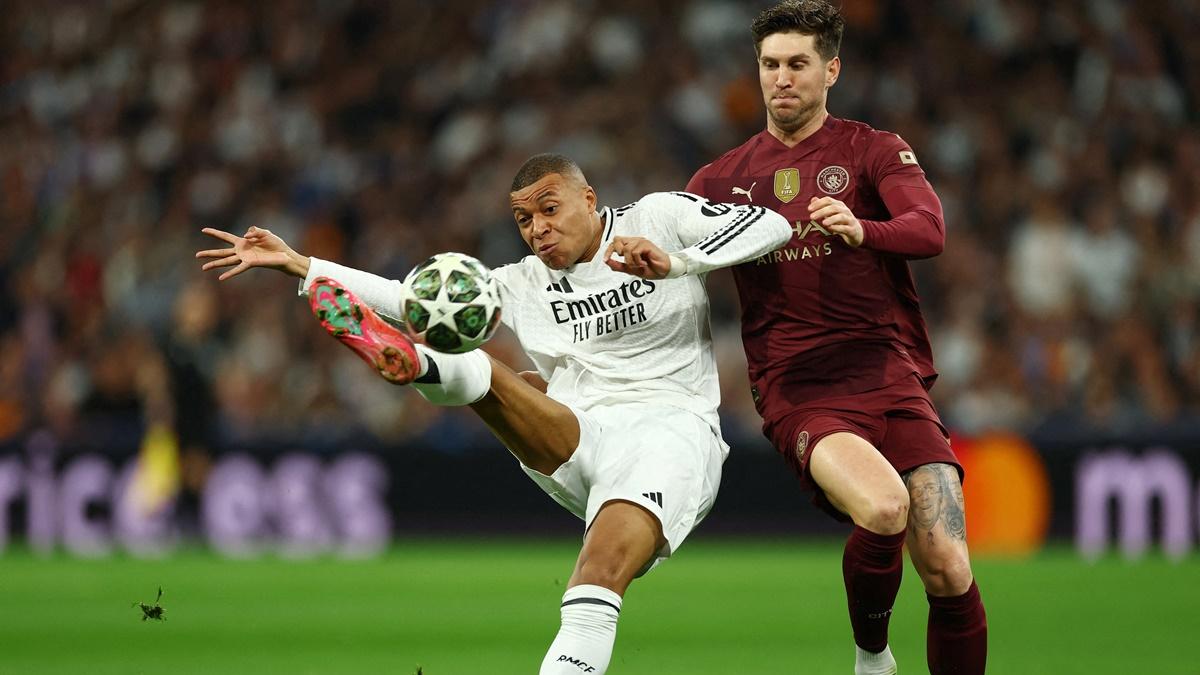 Kylian Mbappe scores Real Madrid's first goal during the Champions League Knock-out phase play-off second Leg against Manchester City, at Santiago Bernabeu, Madrid, Spain, on Wednesday.