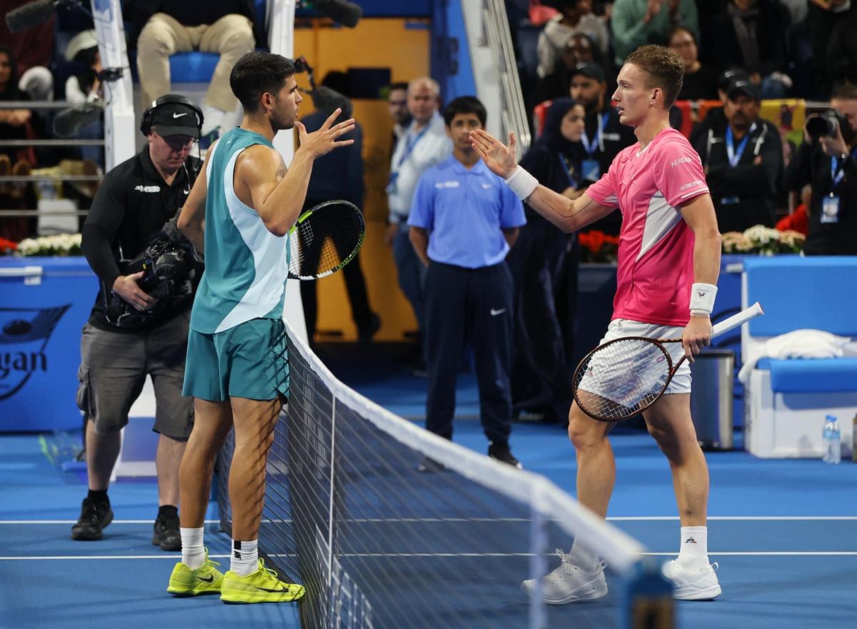 Jiri Lehecka is congratulated by Carlos Alcaraz after the match.