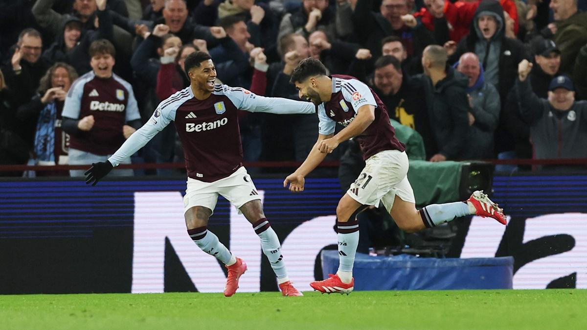 Marco Asensio celebrates scoring Aston Villa's second goal with Marcus Rashford during the match against Chelsea at Villa Park, Birmingham.