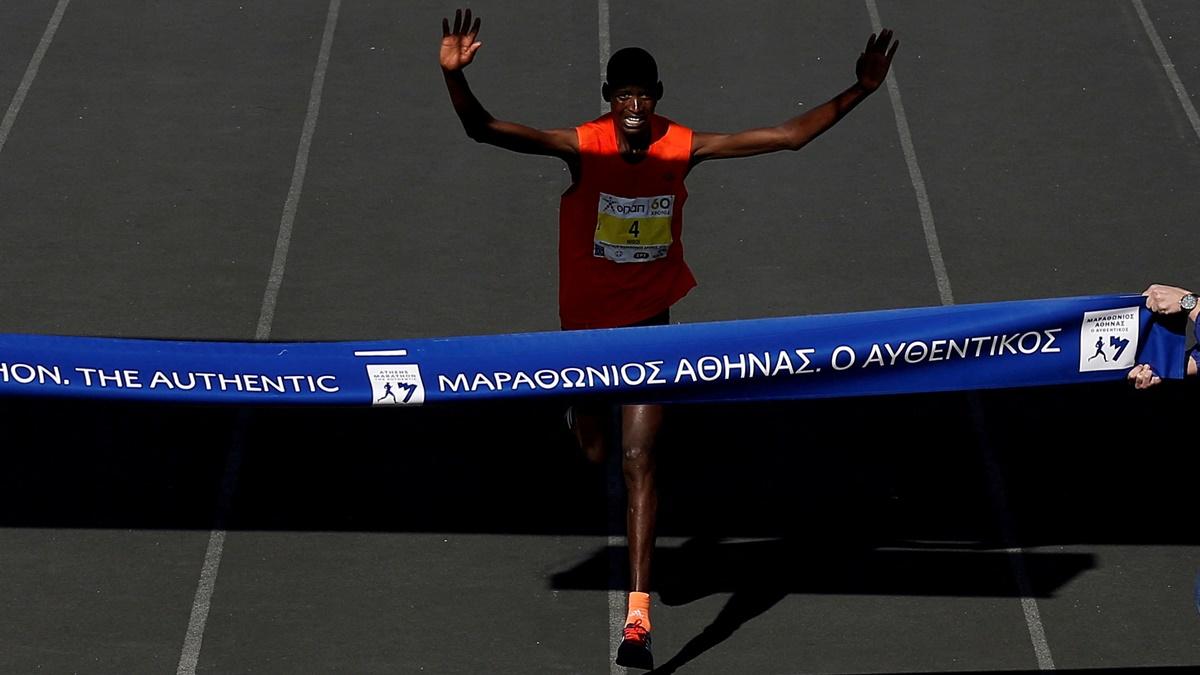 Kenya's Brimin Kipkorir Misoi finishes first in the Athens Marathon, at Athens, Greece,  November 11, 2018. 