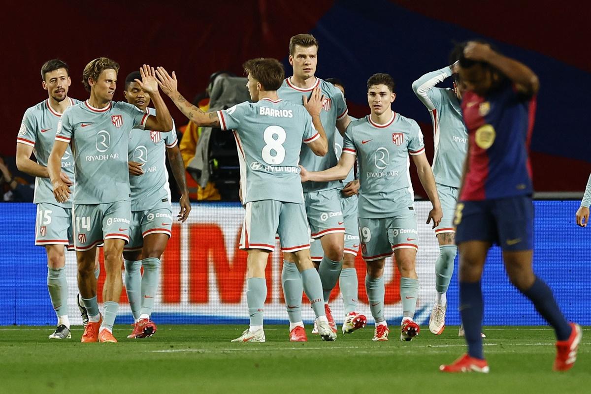 Alexander Sorloth celebrates with Julian Alvarez, Pablo Barrios and Marcos Llorente after scoring Atletico Madrid's fourth goal.