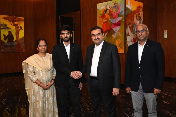 Gautam Adani with D Gukesh and his parents