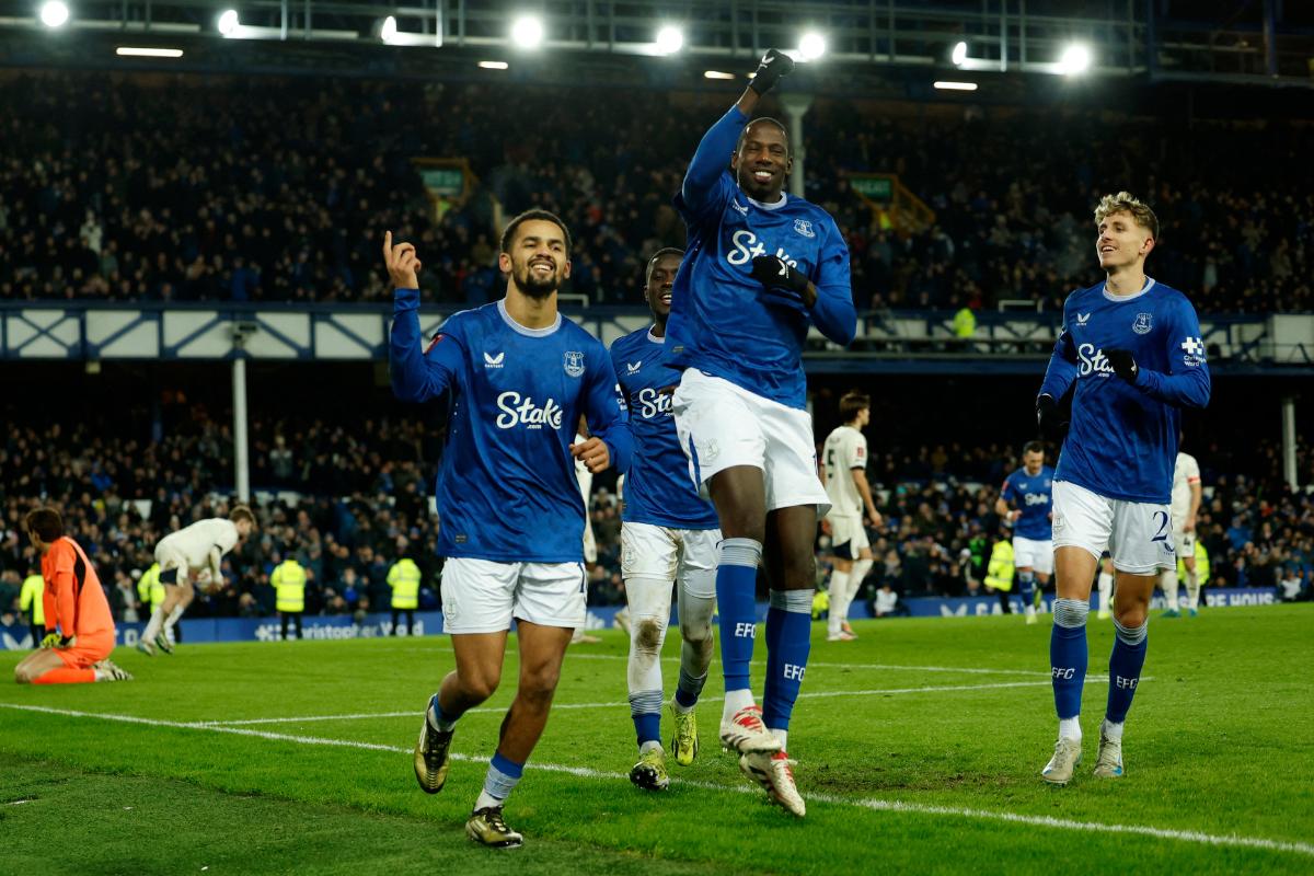 Everton's Iliman Ndiaye celebrates scoring their second goal with Abdoulaye Doucoure and Jesper Lindstrom Action during the FA Cup Third Round match against Peterborough United at Goodison Park, Liverpool on Thursday