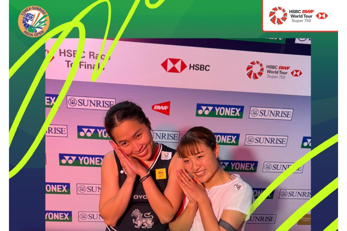 Thai shuttler Ratchanok Intanon and Japan's Nozomi Okuhara share a smile, showing their camaraderie following their first round match at the India Open Super 750 on Tuesday