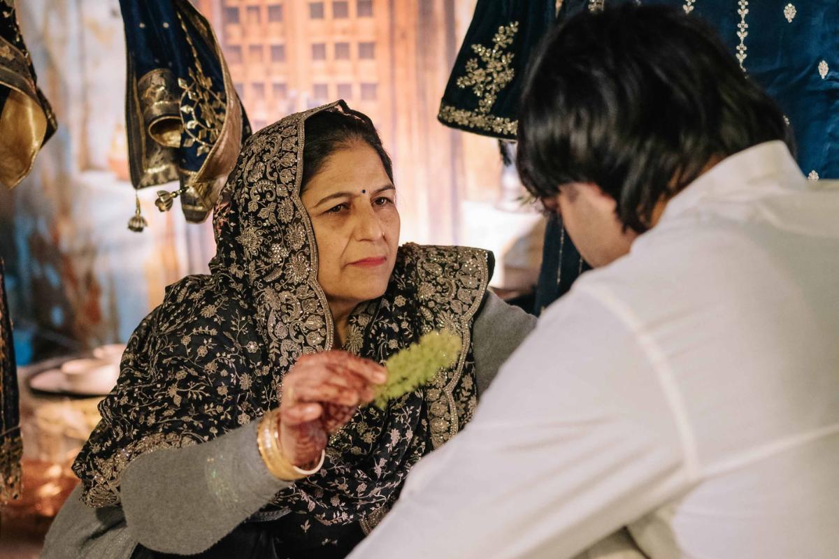 Neeraj's mother Saroj Devi performs a ritual