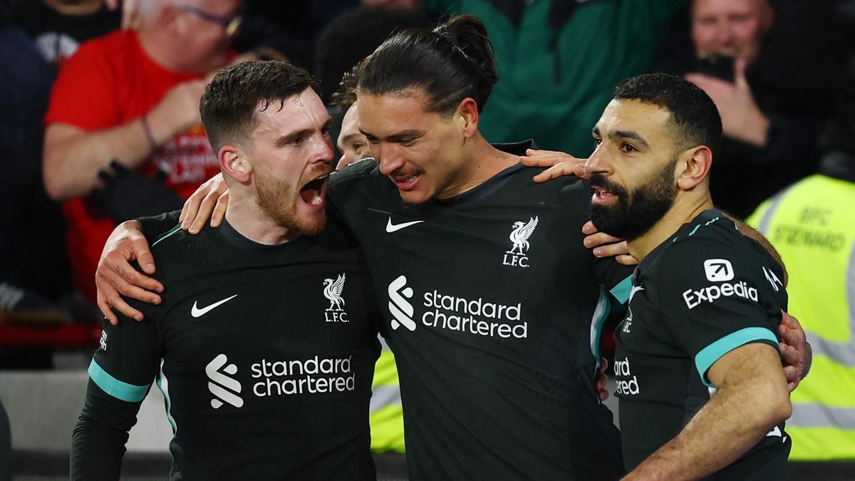 Darwin Nunez celebrates scoring Liverpool's second goal with Andrew Robertson and Mohamed Salah.