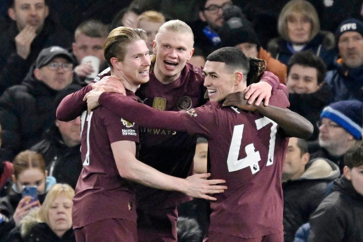 Manchester City's Erling Haaland celebrates teammates Kevin De Bruyne and Manchester City's Phil Foden after scoring their fifth goal against Ipswich Town at Portman Road, Ipswich, Britain