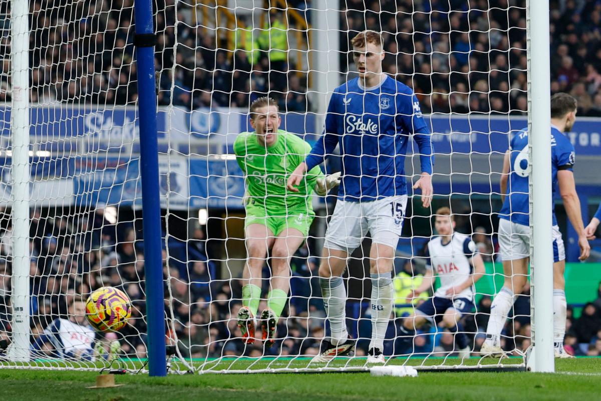 Everton's Jordan Pickford looks dejected after Tottenham Hotspur's Dejan Kulusevski scores their first goal 