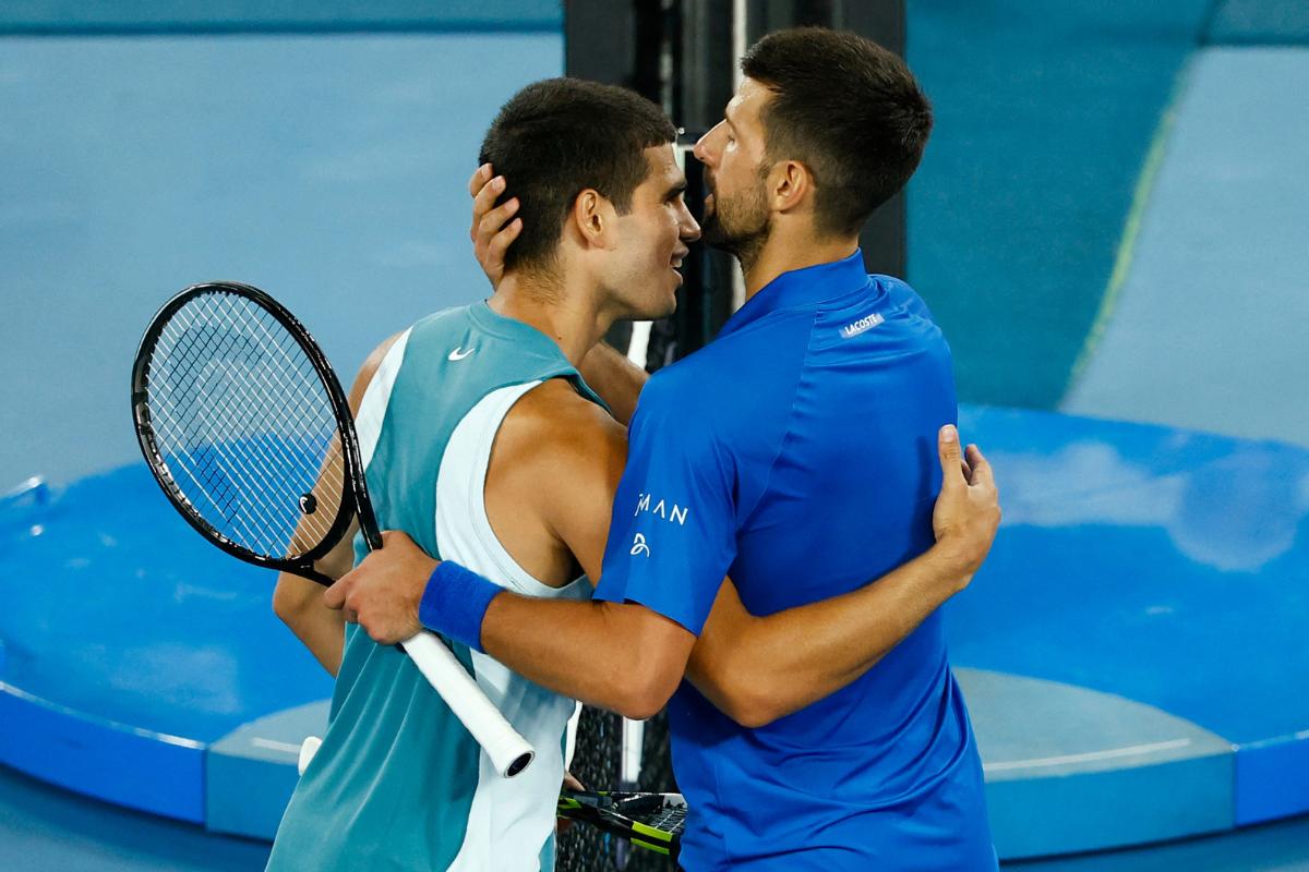 Serbia's Novak Djokovic kisses Spain's Carlos Alcaraz at the after winning his quarter final match 