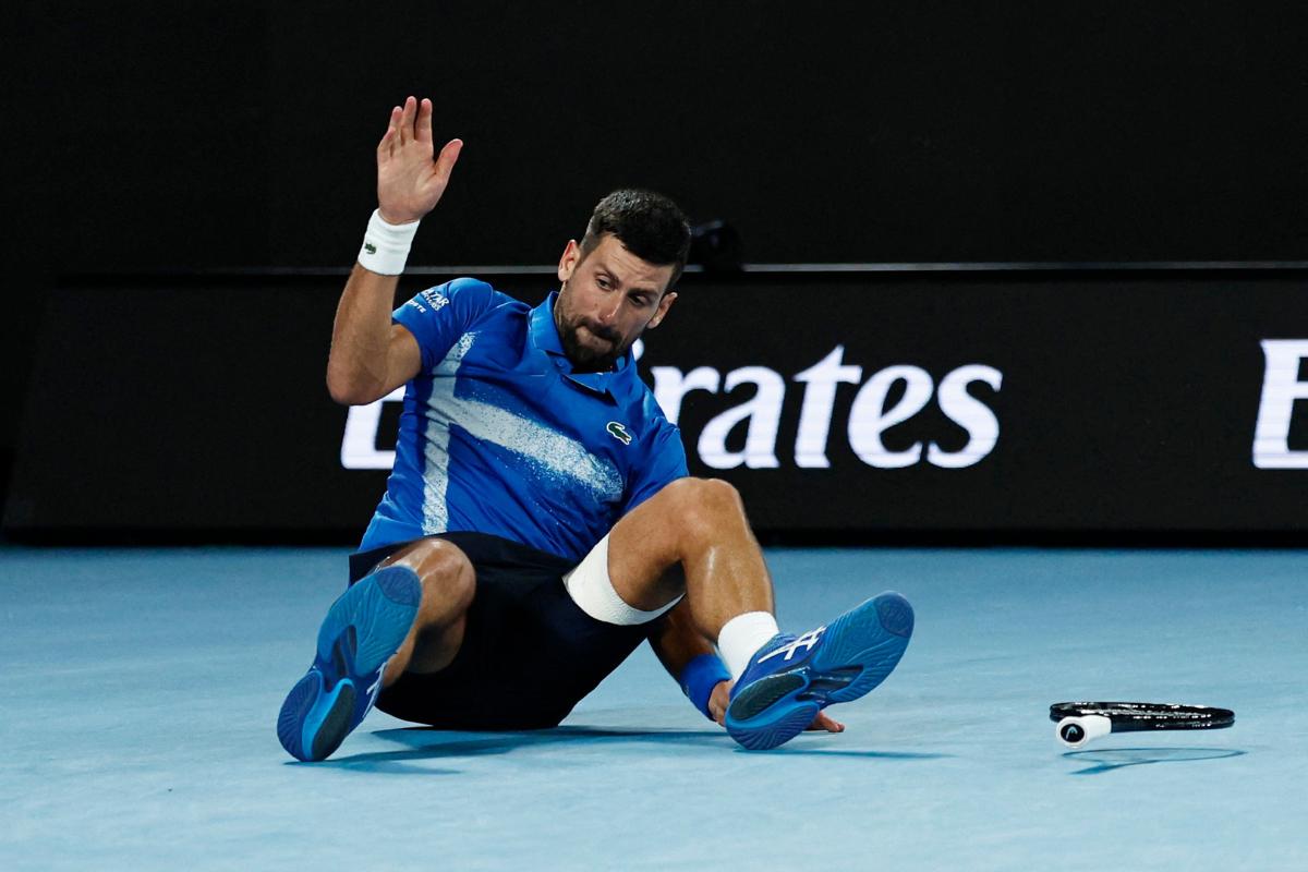 Novak Djokovic falls during his quarter final match against Carlos Alcaraz 