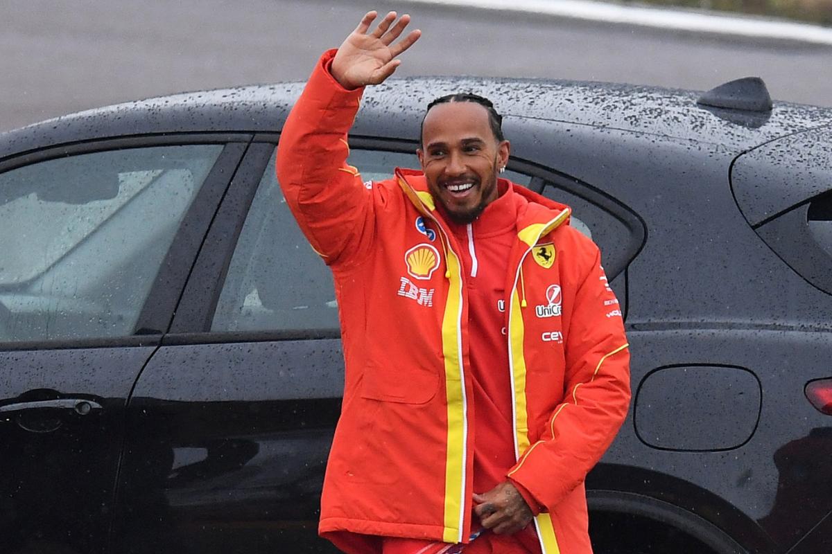 Ferrari's Lewis Hamilton waves at fans during testing  of the Ferrari F1 car at Fiorano Circuit, Fiorano Modenese near Maranello, Italy, on Wednesday