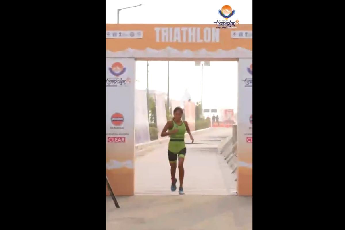 An athlete participates during the Triathlon Mixed Relay event at the National Games in Haldwani, Uttarakhand on Monday