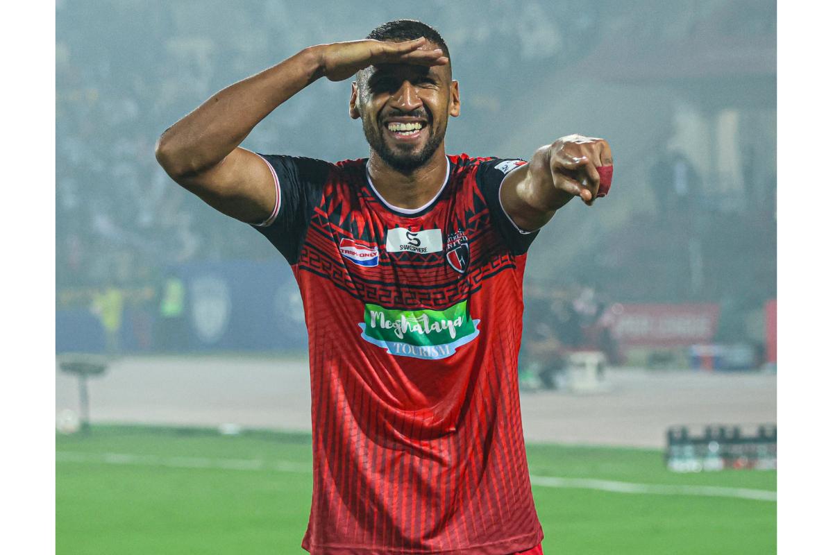 NEUFC's Mohammed Ali Bemammer celebrates scoring the fourth goal against Hyderabad FC during their ISL match in Guwahati on Wednesday