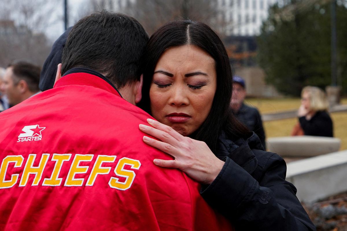 Wichita Mayor Lily Wu hugs an attendee at a prayer vigil for victims of the plane crash of the American Eagle flight 5342, at Wichita City Hall, in Wichita, Kansas, US, on Thursday, January 30, 2025