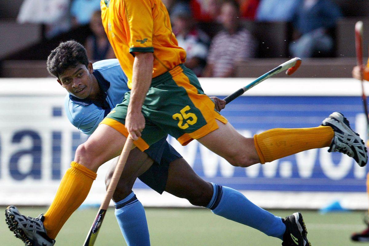  Bimal Lakra (L) during their Champions Trophy field hockey match August 19, 2003
