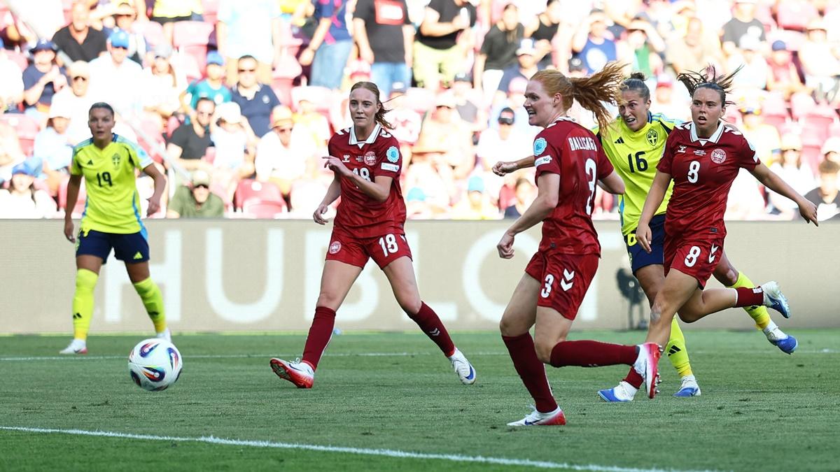 Filippa Angeldahl (No. 16) scores for Sweden during the Group C match against Denmark at Stade de Geneve, Geneva.
