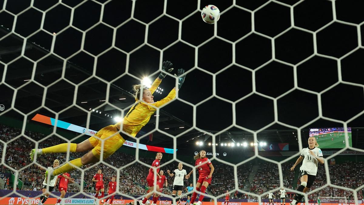 Jule Brand scores Germany's first goal past Poland's Kinga Szemik during the Women's Euro 2025 Group C match against Poland, at Arena St. Gallen, St. Gallen, Switzerland, on Friday.