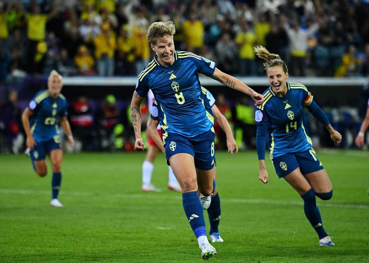 Substitute Lina Hurtig celebrates scoring Sweden's third goal.
