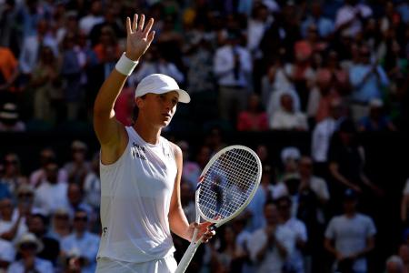 Poland's Iga Swiatek in action during her semi final match against Switzerland's Belinda Bencic