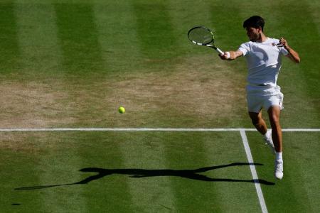Spain's Carlos Alcaraz in action during his semi final match against Taylor Fritz of the US