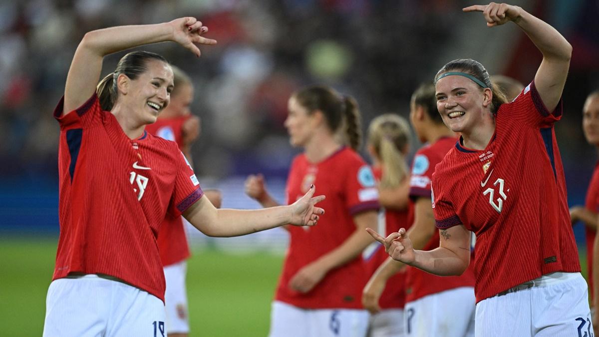 Signe Gaupset (No. 22) celebrates scoring Norway's second goal with Elisabeth Terland.