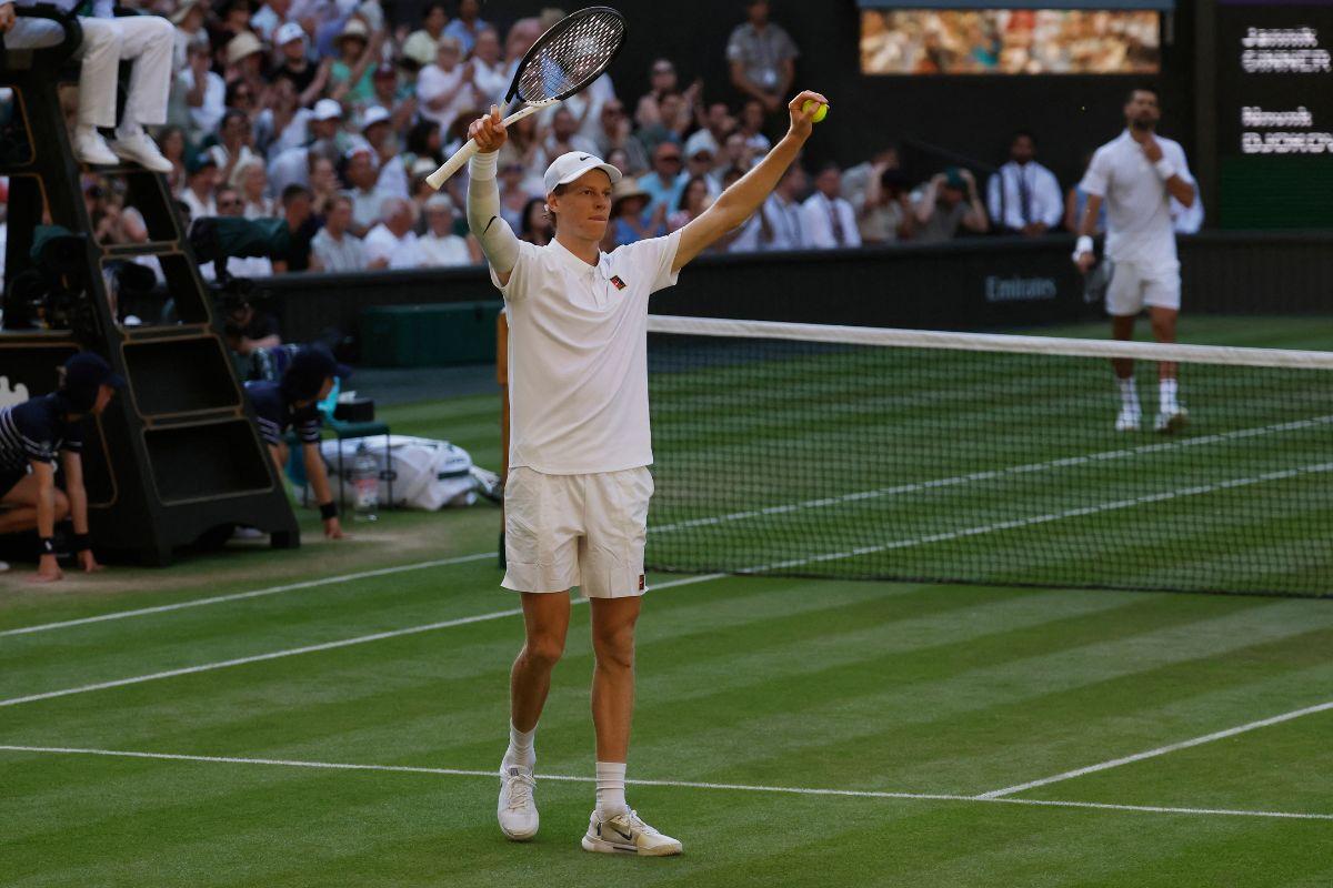 Italy's Jannik Sinner celebrates winning his Wimbledon semi-final match against Serbia's Novak Djokovic