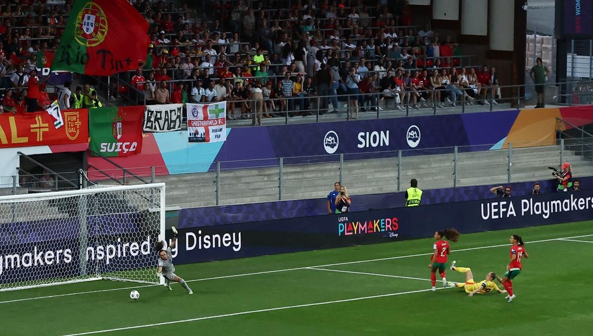Tessa Wullaert sends the ball past Portugal's Patricia Morais for Belgium's opening goal.