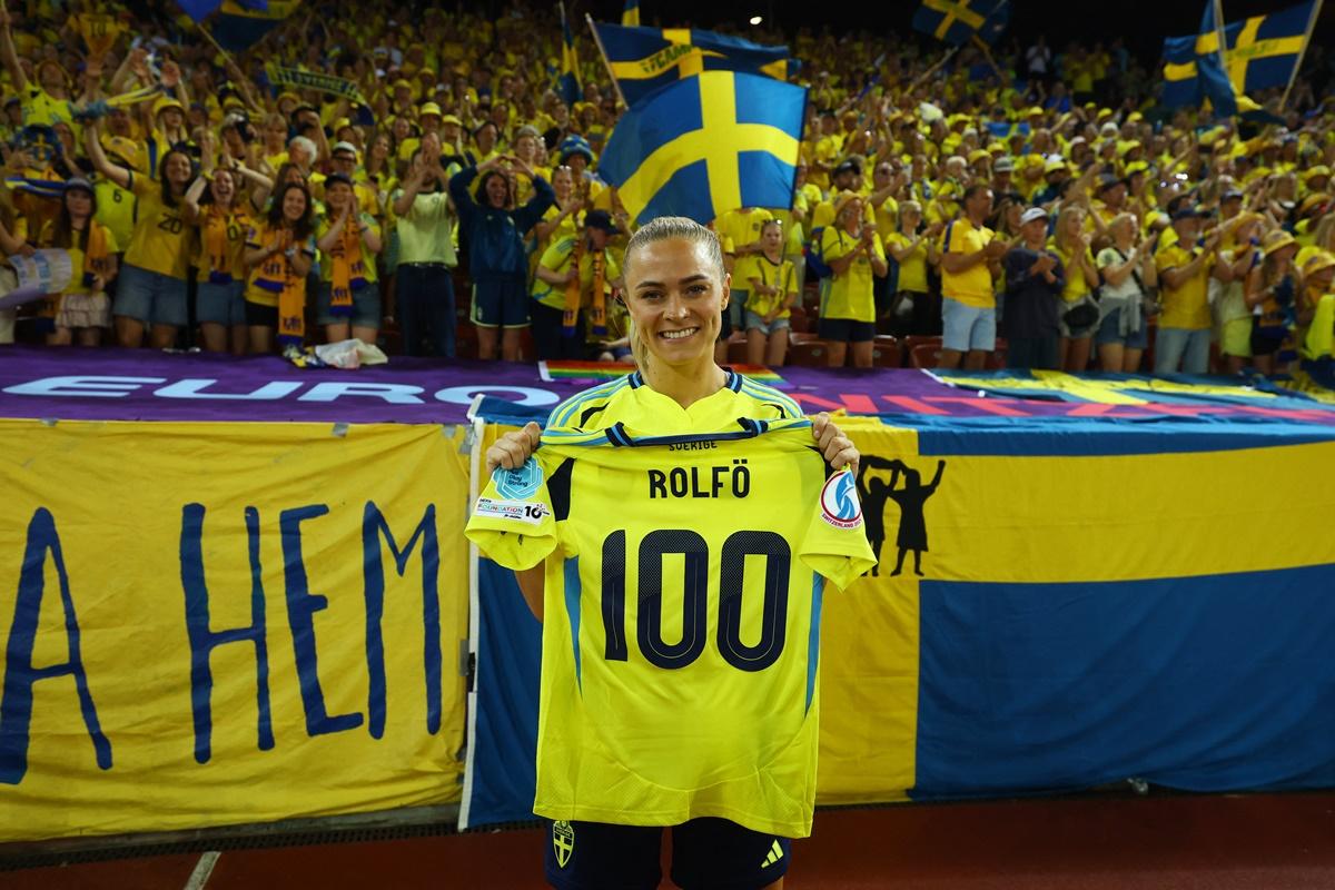 Sweden's Fridolina Rolfo poses with a 100 shirt after her hundredth international appearance.