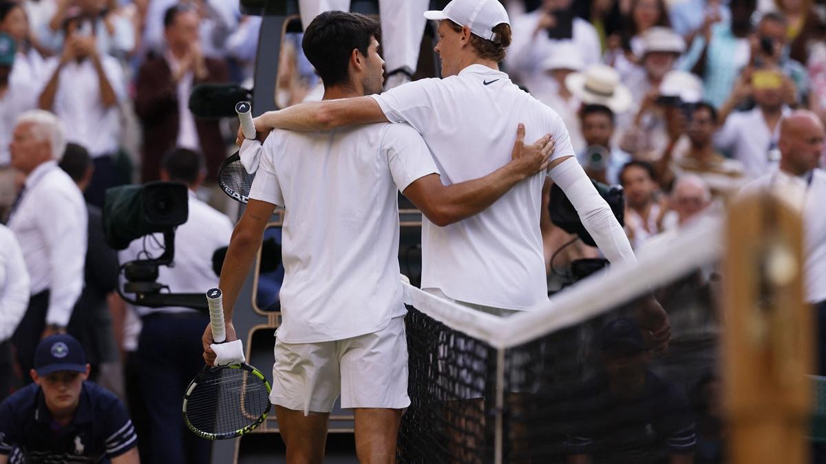 Italy's Jannik Sinner hugs Spain's Carlos Alcaraz after winning the Wimbledon men's singles final at the All England Lawn Tennis and Croquet Club, London, on Sunday.