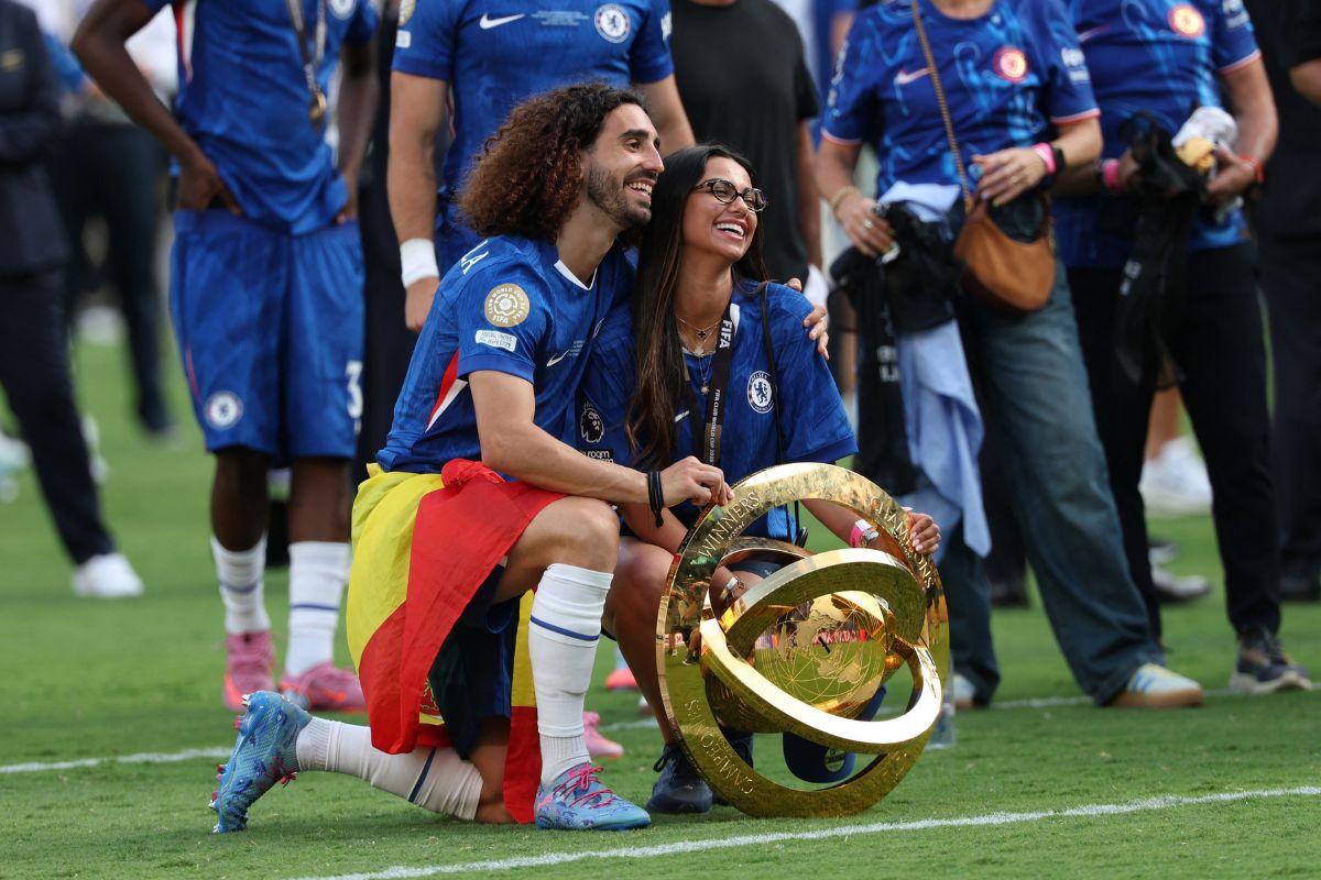 Chelsea's Marc Cucurella celebrates with the trophy and family after winning the FIFA Club World Cup