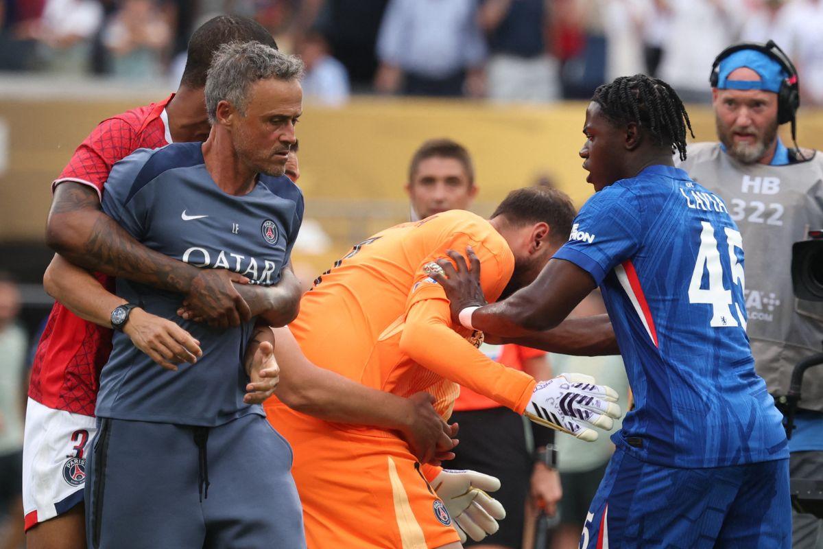  Paris St Germain's Gianluigi Donnarumma and coach Luis Enrique react with Chelsea's Romeo Lavia after the final