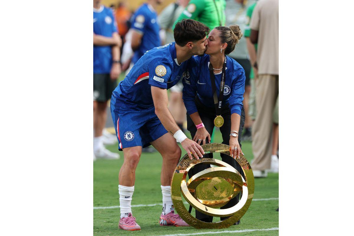 Chelsea's Pedro Neto and Carolina Silva celebrate with the trophy after winning the FIFA Club World Cup