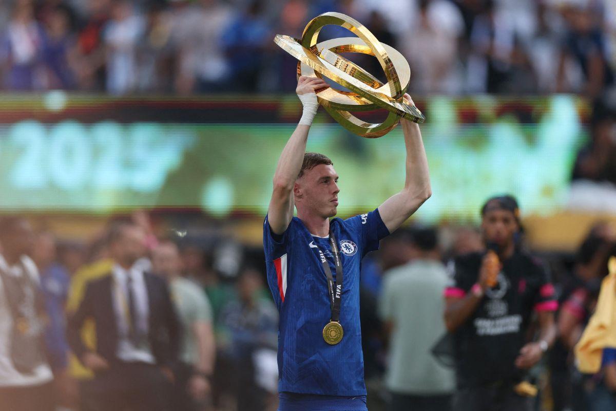 Chelsea's Cole Palmer celebrates with the trophy after winning the FIFA Club World Cup 