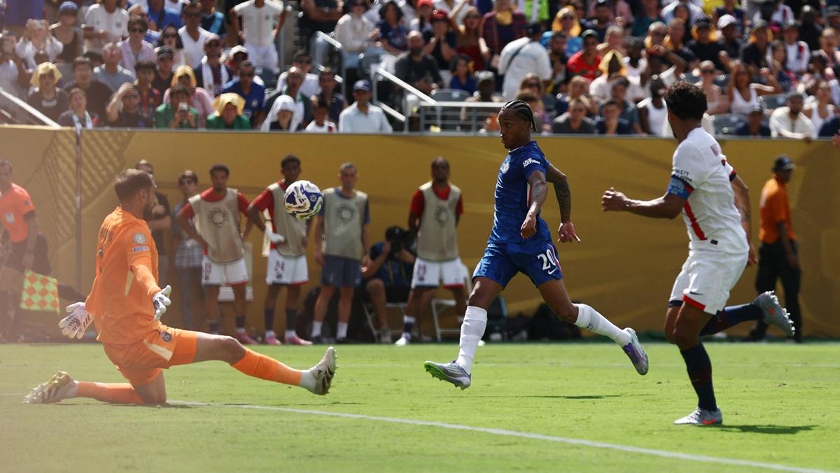 Joao Pedro fires the ball into the Paris St Germain goal to make it 3-0 for Chelsea. 