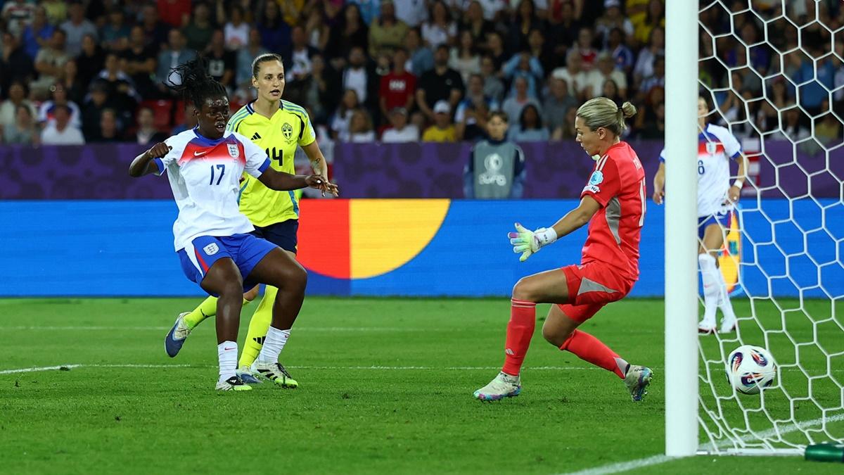 Michelle Agyemang sends the ball past Sweden goalkeeper Jennifer Falk to draw England level in the 81st minute.
