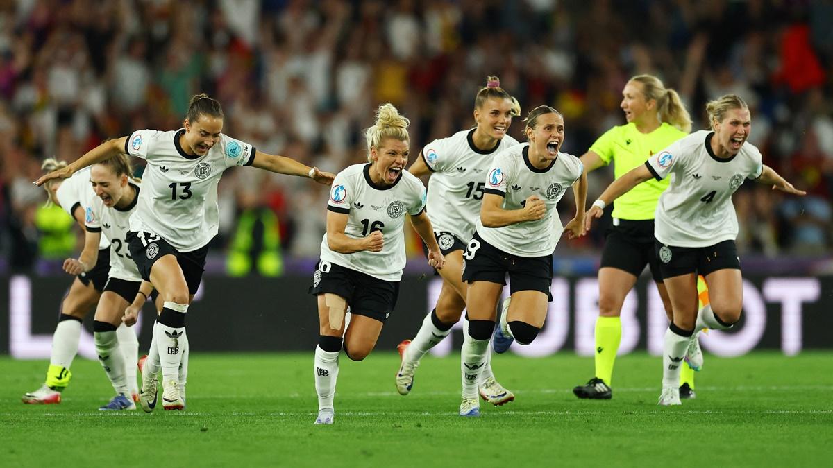 Germany's players race towards goalkeeper Ann-Katrin Berger after winning the penalty shoot-out in the women's Euro 2025 quarter-final against France at St. Jakob-Park, Basel, Switzerland, on Saturday.