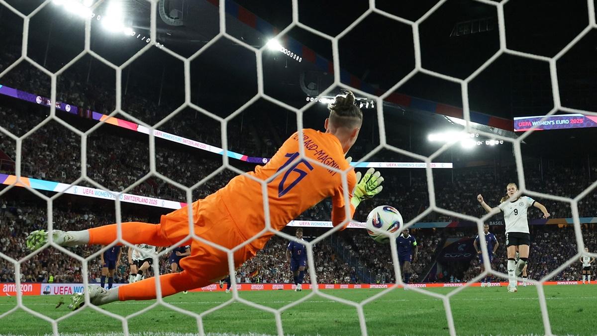 France goalkeeper Pauline Peyraud-Magnin saves Sjoeke Nusken's shot from the penalty spot.