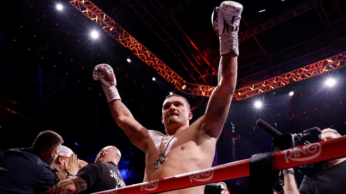 Oleksandr Usyk celebrates victory over Daniel Dubois in Undisputed World Heavyweight title bout at BoxPark Wembley, London, on Saturday.
