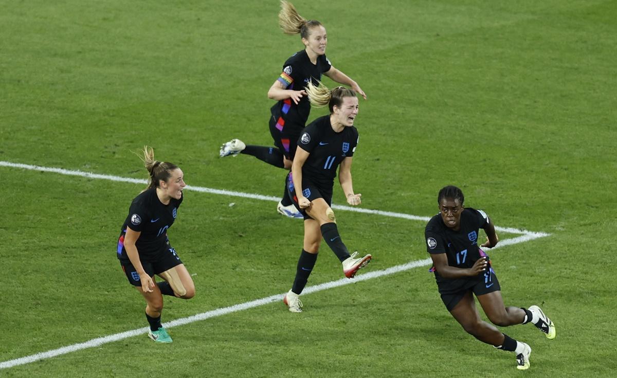 Michelle Agyemang breaks into celebration with Ella Toone and Lauren Hemp after scoring.