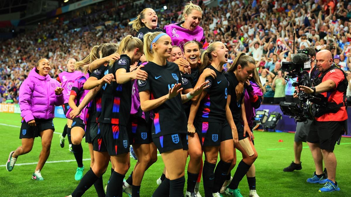 Chloe Kelly (No. 18) celebrates scoring England's second goal with teammates.