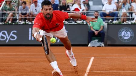 Novak Djokovic stretches to return against Filip Misolic