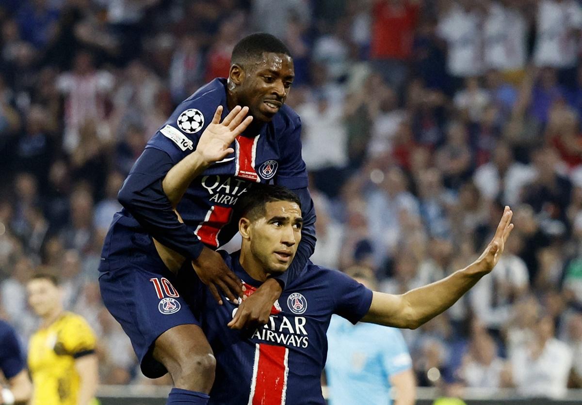 Achraf Hakimi celebrates with Ousmane Dembele after putting Paris St Germain ahead.
