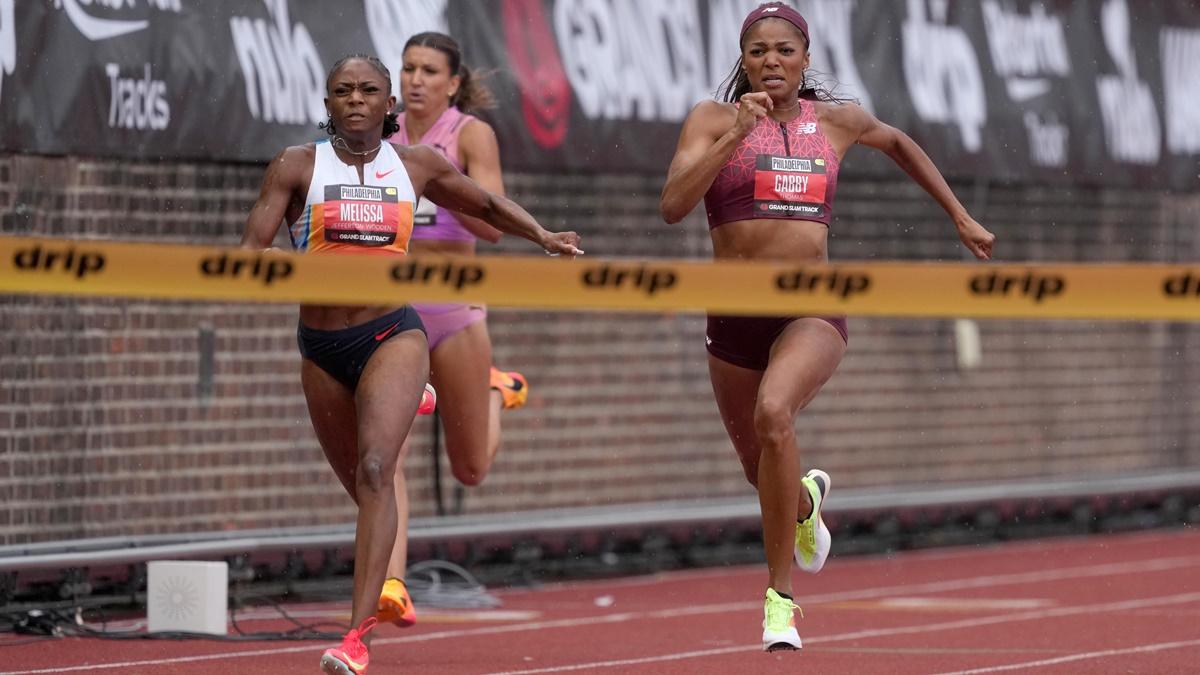 Melissa Jefferson-Wooden (USA), left, defeats Gabby Thomas (USA) to win the women's 200m in the Grand Slam Track Philadelphia, at Franklin Field, on Saturday.
