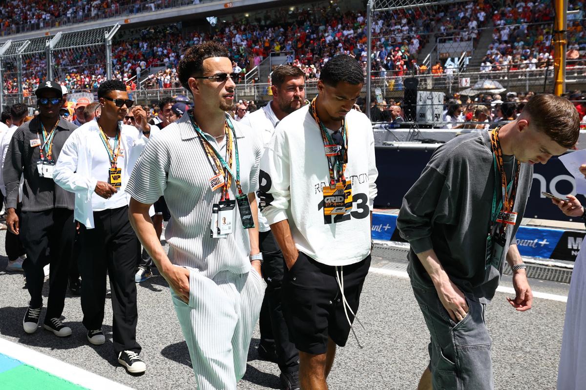 England football players Curtis Jones, Levi Colwill and Cole Palmer on the grid ahead of the race 