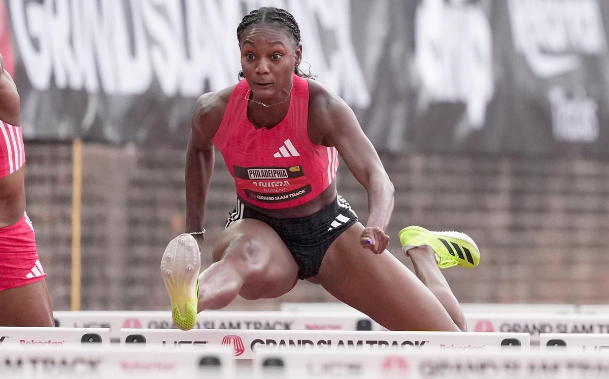 Jamaica's Ackera Nugent wins the women's 100m hurdles.